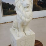 S5816; Milla Pritchard; Lion on podium; 114cm x 42cm x 35cm